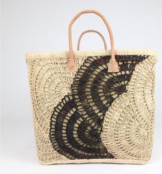 These gorgeous sisal totes are designed and produced in Cape Town, South Africa.  The rustic crochet look makes this piece a bohemian lovers dream! Black Woven Beach Bag Made Of Natural Fiber, Bohemian Beige Beach Bag With Braided Handles, Bohemian Brown Straw Shoulder Bag, Bohemian Beige Woven Beach Bag, Beige Bohemian Straw Bag Rectangular, Bohemian Beige Straw Beach Bag, Beige Bohemian Rectangular Straw Bag, Bohemian Beige Rectangular Straw Bag, Brown Bohemian Straw Tote Bag