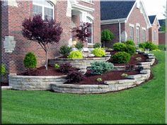 landscaping in front of a brick house