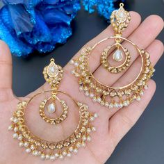 Featuring a pearl chandbali made in 22ct gold and set with freshwater pearls. The earrings weigh 26.49 GMs including 3 GMs of hanging pearls Watch Video Here Gold Chandbali Earrings, Chandbali Earrings Gold, Gold Chandbali, Jadau Jwellery, 22k Gold Jewelry Necklaces, 22k Gold Jewelry, Chandbali Earrings, Pearl Necklace Set, Gold Jewelry Necklace