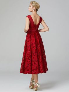 a woman in a red dress is looking back