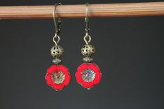 Red Earrings Czech Glass Earrings Flower Earrings Dangle Earrings Drop Earrings Gift For Her Gift for women Color : 12mm red Picasso Hawaii Flower Beads, Opaque, Czech Glass Beads, Hibiscus, Pansey Finish : Antiqued brass findings Size : 1,5 inches including the antiqued brass lever back Ear wires : Antiqued brass lever back Available in green, turquoise, navy blue, yellow, orange, purple and red: https://www.etsy.com/listing/744363663/blue-earrings-flower-earrings-dangle?ref=shop_home_active_27 Red Round Flower Earrings With Ear Wire, Red Flower Drop Earrings, Elegant Red Flower Earrings With Ear Wire, Red Dangle Flower Earrings, Red Flower-shaped Nickel-free Earrings, Red Flower Earrings With Ear Wire, Red Flower-shaped Earrings With Ear Wire, Red Flower Shaped Earrings With Ear Wire, Red Flower Earrings For Pierced Ears