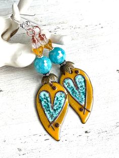 "Love and Friendship  These boho style earrings were made with pretty enamels from AlisonPageStudios, faceted shell beads, rhinestone spacers, metal bead caps, bell flower beads, Czech glass beads, and sterling silver wires.  They measure 2 3/4\" in length.  OOAK." Unique Heart Drop Earrings As Gift, Artistic Dangle Heart Earrings As Gift, Artistic Dangle Heart Earrings For Gift, Artistic Heart-shaped Dangle Earrings For Gift, Artistic Heart-shaped Dangle Earrings Gift, Nickel-free Unique Heart Earrings, Artistic Heart Earrings As Gift, Unique Nickel-free Heart-shaped Earrings, Artistic Heart-shaped Earrings For Gift