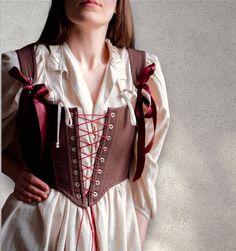 Reversible linen corset with front lacing, Custom corset top, brown & red corset, Renaissance faire costume, Overbust victorian stays Transform your wardrobe with this stunning reversible corset ♡ Adorned in burgundy linen and classic brown linen on the other, this versatile piece offers double the style in one chic design. Featuring front lacing this corset ensures a perfect fit while adding an elegant touch to any ensemble.  ♡ Features♡ An accessory that evokes feelings of femininity, slendern Gothic Brown Corset For Costume, Brown Gothic Corset For Costume, Medieval Underbust Corset Dress With Corset Back, Medieval Overbust Bodice With Corset Back, Medieval Underbust Corset Dress, Fitted Brown Corset Dress With Corset Back, Medieval Style Brown Overbust Corset, Brown Fitted Corset Dress With Corset Back, Medieval Brown Overbust Corset