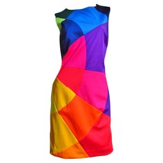 A fabulous colorful dress with a bit of stretch from Moschino. It is is sleeveless with a crew neck and incredible brightly colored shapes each individually sewn together comprising the front of the dress, the back is solid black. It is lined in black and has a back zipper. Fits sizes Medium. Bust 38" Waist 32" Hips 40" Length 37" Maroon Outfit, Chic Evening Dress, Moschino Dress, Color Blocking Outfits, Red Sleeveless Dress, Color Block Dress, Moschino Cheap And Chic, Dress Closet, Sleeveless Short Dress