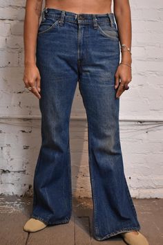 Vintage 70s Levis 684 Bell Bottom Jeans. Orange Tab, Talon 42 zipper, beautiful blue, five pockets, high waisted. Made In USA Good Vintage Condition - Wear and tear near button fastener see pic Tag Says W33 L31 Waist- 34" Hip - 42" Rise - 11" Inseam - 30" 70s Levis, Bottom Jeans, Womens Jeans, Bell Bottom, Beautiful Blue, Vintage 70s, Bell Bottom Jeans, Halloween Shopping, Women Jeans