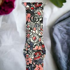 Welcome additional luxury to your Apple Watch with this exquisite GG Floral Silicone Watch Band. Soft and comfortable, its sophisticated design will add a touch of class to any occasion. Embrace a timeless look that exudes confidence, class, and sophistication!. *Beautiful silicone band *Standard Length *Available in 2 sizes: 38/40/41 MM and 42/44/45/49 MM *This band will fit every series of Apple Watches Elegant Pink Bracelet Strap Apple Watch Band, Luxury Pink Watch Band As Gift, Luxury Adjustable Apple Watch Band For Gift, Elegant Adjustable Apple Watch Band, Luxury Pink Adjustable Watch Bands, Luxury Adjustable Pink Watch Band, Elegant Adjustable Pink Watch Bands, Luxury White Adjustable Apple Watch Band, Luxury Adjustable White Apple Watch Band