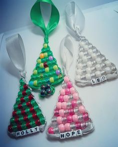 three christmas tree ornaments with the word hope spelled on each ornament in different colors