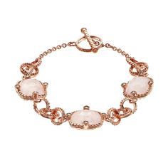 "Adorned with checkerboard-cut genuine rose quartz stones highlighted with marcasite stones and textured intertwined links, this 18k rose gold over sterling silver toggle bracelet makes an enchanted accessory.BRACELET DETAILS Length: 7.5 in. Clasp: toggle Metal: 18k rose gold over sterling silver Made with Swarovski Marcasite STONE DETAILS Stone type: genuine rose quartz Total weight: 9 1/10 ct. Shape: checkerboard cut Setting: bezel  Size: 7.5"". Color: Multicolor. Gender: female. Age Group: ad Elegant Pink Faceted Bracelet, Elegant Rose Quartz Gemstone Bracelets, Elegant Rose Quartz Gemstone Bracelet, Elegant Rose Quartz Gold Bracelets, Elegant Gold Rose Quartz Bracelets, Elegant Gold Bracelets With Rose Quartz, Elegant Rose Quartz Rose Gold Bracelets, Elegant Rose Quartz Jewelry For Formal Occasions, Elegant Rose Gold Rose Quartz Bracelets