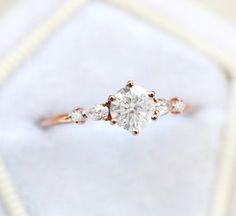 an engagement ring with three stones on it