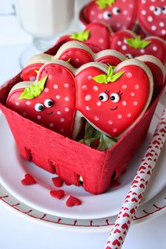 some strawberries are in a box on a plate