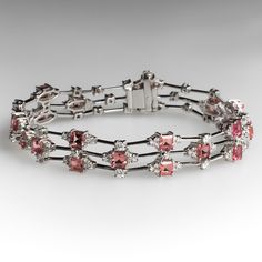 The fancy link three-row bracelet is accented with a total of twenty-one (21), prong set, square step cut natural pink tourmaline and one hundred fifty-five (155), prong set, round brilliant cut diamonds. The bracelet measures 12.5mm wide and an overall length of 7-1/2 inches. The bracelet is finished with a box clasp and fold-over safety. Tourmaline Rings, Precious Stones Bracelet, Tourmaline Jewelry, Step Cut, Box Clasp, Tourmaline Ring, June Birth Stone, Vintage Bracelets, Brilliant Diamond