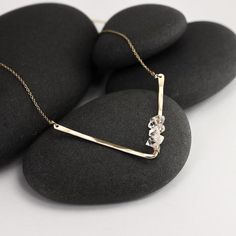 These herkimer diamond layering necklaces are just delightful - they reflect light from the gold chain, the gently hammered V pendants, and from the beautiful herkimer stones.  The stones feature the occasional imperfection and a range of variations in structure that natural stones do, and it gives them a wonderful sparkle and interest, but they are all stunning, bright stones that catch and reflect the light beautifully .  Layer these up with the simple herkimer pendant necklaces.The stones are Minimalist Hammered 14k Gold Filled Necklaces, Delicate Hammered Jewelry For Everyday, Delicate Everyday Hammered Jewelry, Dainty Hammered 14k Gold Necklace, Everyday Minimalist Hand Forged Necklaces, Minimalist Everyday Hand Forged Necklaces, Dainty Hand Forged 14k Gold Filled Jewelry, Dainty Hand Forged Necklace For Everyday, Everyday Hammered 14k Gold-filled Necklace