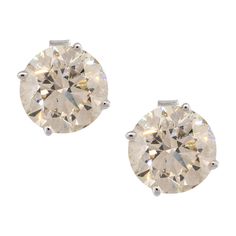 Material: 14k white gold Diamond Details: Approx. 4.21cts of round brilliant diamonds. Diamonds are L/M in color and SI1 in clarity Measurements: 8.1mm x 14.6mm x 8.1mm Earrings Backs: Tension post Total Weight: 1.9g (1.2dwt) Additional Details: This item comes with a presentation box! SKU: G10633 Diamond Earrings Studs Round, Gold Diamond Earrings Studs, Gold Diamond Studs, Floral Studs, Heart Earrings Studs, Brilliant Diamond, Earring Backs, Diamond Earrings Studs, Diamond Studs