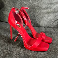 Worn Once. New Without Tags. Red High Heels With Heel Strap, Red Open Heel Shoes With 4-inch Heel, Red Heels With 4-inch Open Heel, Red Open Heel 4-inch Heels, Red Open Heel Heels With 4-inch Heel, Red Patent Leather Heels With Wrapped Heel, Red Heels With Padded Heel And Ankle Strap, Red Platform Heels With Open Heel, Red Synthetic Open Heel Heels