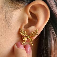 🌻These stud earrings feature a delicate butterfly design, adding a touch of whimsy and elegance to your look. 🥰This piece is meticulously crafted from S925 sterling silver(total 7.0g) and finished with a luxurious coating of genuine 18k gold plating. 🥰This earrings are adjustable to fit your desired size. 🥰We will send it in a beautiful jewelry box and package it carefully. We offer boxes in blue, green, white, and black. Please leave a message specifying your preferred color 🥰Please leave a message if you need any assistance. Thank you. Butterfly Charm Wing-shaped Earrings For Gift, Butterfly Charm Earrings As Gift, Elegant Gold Butterfly Earrings, Elegant Gold Butterfly-shaped Earrings, Wing-shaped Earrings For Gift, Wing-shaped Pierced Earrings For Gift, Wing-shaped Pierced Earrings As Gift, Gold Butterfly Charm Earrings For Party, Gold Earrings With Butterfly Charm For Party