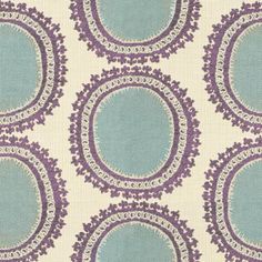 a blue and white wallpaper with circular designs on the back ground, in shades of purple