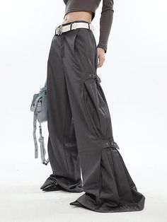 These Buckled Wide Leg Pants will give you the perfect comfortable and chic look. The buckles on the sides add both style and subtle detailing, while the wide leg cut provides a flattering silhouette. Model is 5'3 100lbs wearing S Chic Wide Leg Pants With Belted Cuffs, Belted Wide Leg Pants For Fall, Chic Straight Leg Parachute Pants With Belt Loops, Wide Leg Cargo Pants With Belt Loops, Fall Wide Leg Pants With Belt Loops, Wide Leg Parachute Pants With Belt Loops, Chic Wide Leg Parachute Pants With Belt Loops, Chic Wide-leg Parachute Pants With Belt Loops, Fall Wide-leg Parachute Pants With Belt Loops