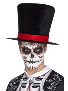 a man wearing a top hat and skeleton makeup