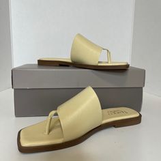 Franco Sarto Merci Sandal Size: 6.5 M Color: Lemonade (Pastel Yellow) New With Box Featuring An Angular Square Toe And Sleek Silhouette, This Minimal Leather Sandal Is A Versatile Addition To Your Warm-Weather Wardrobe. Thong Toe Slip-On Style Leather Upper, Synthetic Lining And Sole Imported Please Review All Pictures As They Are Part Of The Description- No Returns Cream Toe Post Sandals In Synthetic Material, Cream Toe Post Synthetic Sandals, Yellow Synthetic Toe Post Sandals, Yellow Synthetic Sandals With Heel Loop, Chic Yellow Slip-on Sandals, Cream Toe Post Sandals For Spring, Yellow Medium Width Sandals For Summer, Spring Cream Toe Post Sandals, Yellow Open Toe Sandals Medium Width