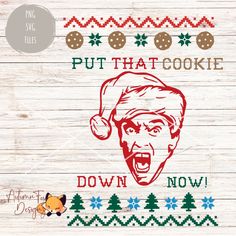 a wooden wall with an ugly santa clause on it and the words put that cookie down now