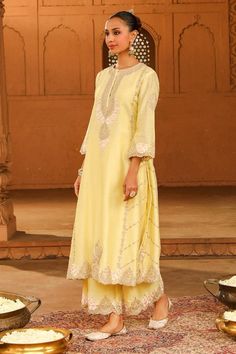 Lemon yellow silk chanderi A-line kurta with kashmiri tilla and parsi gara embroidery. Comes with palazzo and a silk organza dupatta. - Aza Fashions Elegant Straight Kurta Palazzo Set With Cutdana, Elegant Chanderi Palazzo Set With Cutdana, Elegant Yellow Traditional Wear For Festive Occasions, Yellow Tissue Silk Kurta With Zari Work, Elegant Yellow Sharara With Traditional Drape, Elegant Designer Yellow Anarkali Set, Elegant Yellow Anarkali Set For Designer Wear, Elegant Yellow Traditional Wear With Cutdana, Elegant Yellow Navratri Dress