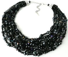 8 strands of black glass pearls are weaved together with sparkling aurora borealis black crystals and bugle beads in this stunning mid-century/vintage style piece.It's everything you need in a black statement necklace, with a pop of sparkling color to create the perfect elegant evening jewelry.Measurements: Approximately 17 inches with a 3 inch extender chain. Length can be adjusted upon request. Thank you for visiting my shop! Please feel free to message me with any questions, comments or custo Evening Black Beaded Necklaces, Black Multi-strand Jewelry For Evening, Multi-strand Beaded Necklaces For Evening, Multi-strand Beaded Necklace For Evening, Beaded Multi-strand Necklace For Evening, Glamorous Black Beaded Jewelry, Black Multi-strand Beaded Necklace For Evening, Multi-strand Black Beaded Necklace For Evening, Costume Jewelry Beaded Necklace With Round Beads For Evening