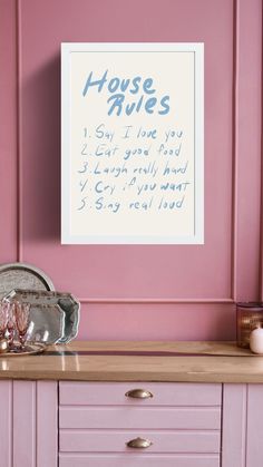 a pink dresser with a sign on it that says house rules