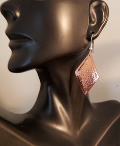 Hammered copper diamond shape earrings available in 4 sizes. The ear wires are sterling silver. My unique hammering technique domes them slightly and hardens the metal a little so they hold their shape well. They are not heavy. Select size small, just under 1 inch plus the ear wire about 1&1/2 inches total, medium, about 1&1/4 inches plus the ear wire so about 1&3/4 inches, large, about 1&1/2 inches plus the ear wire making them about 2 inches overall, and extra large, about 2 in Silver Hypoallergenic Copper Earrings, Hammered Silver Copper Earrings, Hammered Silver Earrings Made Of Copper, Silver Hammered Copper Earrings, Hammered Rose Gold Copper Earrings, Rose Gold Hammered Dangle Earrings, Rose Gold Hammered Metal Earrings, Hammered Copper Earrings, Diamond Shape Earrings