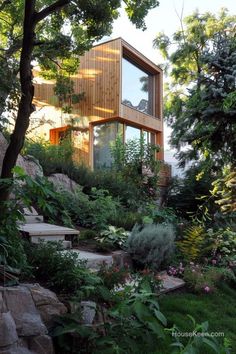 a house that is surrounded by trees and plants