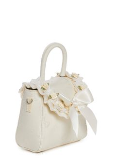 cuz you are the queen of gems. This handbag has a brocade construction with a bow design, flower and lace appliques, a bow in front adorned with a pearl charm, a top handle, a removable shoulder strap, and a front snap button closure. Party Cream Top Handle Bag, Cream Top Handle Party Bag, Cream Top Handle Party Bags, Cream Top Handle Bag For Party, Formal Feminine Cream Bag, Formal Feminine Cream Bags, White Shoulder Bag With Detachable Handle For Wedding, Elegant Bag With Detachable Bow For Gift, Elegant Bag With Detachable Bow As Gift