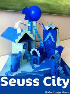 there is a blue and white castle made out of paper with the words seuss city on it