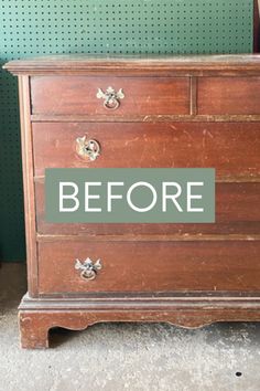 an old wooden dresser with the words before painted on it's bottom and bottom