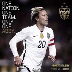 a soccer player is running with the words, one nation one team only aby