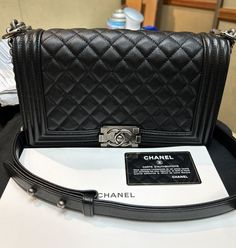 Chanel Quilted Medium Boy Flap Shoulder Bag Pre owned Black Caviar Serial #289***** Includes manual,authenticity card,& dust bag Flap Shoulder Bag, Black Caviar, Shoulder Handbag, Shoulder Handbags, Bags Handbags, Dust Bag, Shoe Accessories, Chanel, Bag Lady