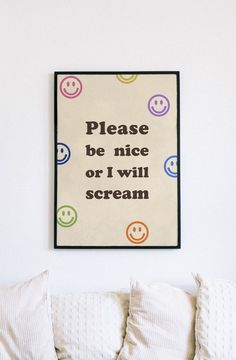 a poster on the wall above a bed with pillows and blankets in front of it that says, please be nice or i will scream