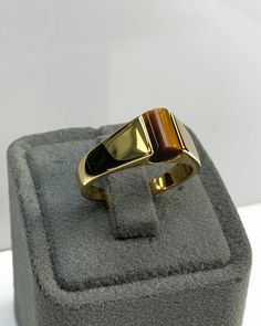 Tiger Eyes Men Ring, Blue Pinky Ring, Cylinder Genuine Gemstone, Stylish Gold Silver Ring, Handmade Jewelry, Best Gift for Him ◎ Details ◎ ○ Material 14K Solid Gold or 925 Sterling Silver Weight of Ring : approx 7.00 gr Height of Ring : approx 6.15 mm Width of Band : approx 6.80 mm ○ Upgrade to Solid 18K Gold, please click the link below: https://www.etsy.com/listing/962826004 ○ Gemstone Natural Tiger Eyes approx. 6.80 mm x 6 mm approx. 1 ct Made to Order HANDMADE ITEM ○ For Men Collection : htt Classic Brown Rings With Polished Finish, Classic Brown Gemstone Rings, Brown Polished Signet Ring For Anniversary, Brown Polished Finish Signet Ring For Anniversary, Tiger Eyes, Topaz Color, Best Gifts For Her, Men Ring, Ring Blue