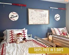 a baseball themed bedroom with blue walls and white bedding