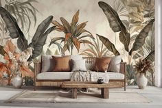 a couch sitting in front of a wall with tropical plants on it's sides