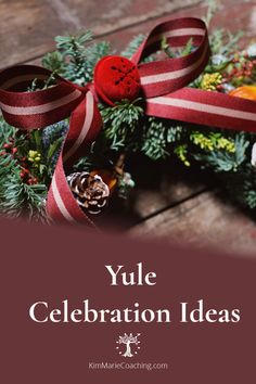 a wreath with red ribbon and pine cones on it that says yule celebration ideas