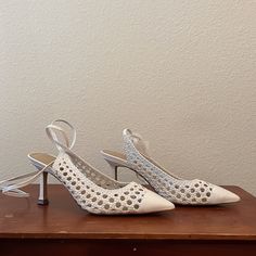 White Woven Leather Pumps. Never Worn. Spring Lace-up Heels For Formal Occasions, Spring Formal Lace-up Heels, Spring Lace-up Heels With Padded Heel, Spring Lace-up 4-inch Heels, White Flat Heels For Fall, Elegant Perforated Heels For Spring, Chic White Lace-up Heels, White Ankle Strap Heels In Faux Leather, Elegant Pointed Toe Heels With Perforations