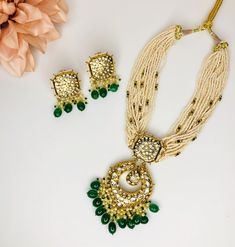 This Rajasthani handmade necklace is an elegant piece for any event. It's simple enough to wear during daytime as well as a beautiful piece for any evening event. The finish is of a beautiful gold color while the pearls and green beads add a touch of traditional look. Festive Kundan Necklace With Gota Work For Reception, Kundan Temple Necklace For Reception With Stone Work, Reception Kundan Temple Necklace With Stone Work, Temple Style Bridal Necklace For Reception With Gota Work, Festive Kundan Pearl Necklace For Party, Gold Chandbali Beaded Necklaces For Wedding, Festive Kundan Temple Necklace With Gota Work, Gold Chandbali Beaded Necklace For Wedding, Kundan Pearl Necklace For Wedding