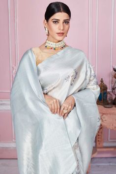 Beautiful powder blue floral Banarasi saree with zari border and pallu is a perfect drape for festive occasions. It comes with a blouse piece. Disclaimer: The shown stitched blouse on the model is for display purpose only. The saree comes with a matching blouse piece and finished with fall and piko. Festive Light Blue Saree For Reception, Festive Light Blue Saree With Unstitched Blouse, Elegant Light Blue Saree With Zari Work, Elegant Light Blue Saree With Cutdana, Elegant Light Blue Saree With Resham Embroidery, Light Blue Saree For Reception And Diwali, Elegant Light Blue Saree For Festivals, Traditional Light Blue Zari Work Blouse Piece, Traditional Light Blue Saree With Unstitched Blouse