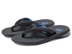 Reef Anchor - Men's Shoes : Grey/Blue : For those that stay close to the beach we present the water-friendly style and high-rebound comfort of the Reef Anchor sandals. Flip-flops in a stylish, cushioned silhouette. Water-friendly synthetic upper straps with hot melt detailing and super soft padded jersey lining. Compression molded, high-rebound EVA footbed with airbag cushioning for all-day comfort. Non-marking rubber outsole for grippy traction and durable wear. PVC-free construction. Imported. Measurements: Weight: 8 oz Product measurements were taken using size 9, width D - Medium. Please note that measurements may vary by size. Comfortable Slides With Ortholite Insole For The Beach, Nylon Sandals For Summer Vacation, Vacation Nylon Sandals With Cushioned Footbed, Beach Sandals With Textured Footbed, Nylon Open Toe Sandals For Vacation, Summer Sandals With Textured Footbed, Summer Synthetic Flip Flops With Arch Support, Open Toe Nylon Sandals For Vacation, Synthetic Flip Flops With Arch Support For Summer