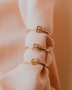 Initial Stacking Ring Our initial rings are a perfect way to represent your loved ones. Stack one with our everyday stacking rings, or stack more than one initial at a time. Gold - 14k Gold Initial on a 14k Gold Filled Band Silver - 14k White Gold Initial on a Sterling Silver Band **Please indicate your initial(s) in the box above** If purchasing more than one ring, make sure to change the quantity. Please note that this piece may take 7-14 days to be made and shipped. Initial Rings, Gold Stacking Rings, Gold Initial Ring, Initial S, Initial Ring, Gold Filled Ring, Gold Ring Stack, Gold Initial, Personalized Rings