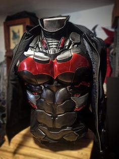 a batman mask is on display in a shop