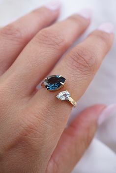 This piece features two pear-shaped blue topaz stones in a toi et moi setting which is sure to make a statement. Please allow 1-2 weeks for delivery. Blue Topaz Stone, Aquamarine Ring, Sky Blue Topaz, Aquamarine Rings, Topaz Stone, Pretty Rings, London Blue Topaz, Topaz Gemstone, Ring Collections