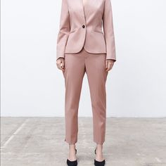 Mid-Waist Trousers With Front Pockets And False Rear Welt Pockets. Featuring Side Vents At The Hems And Metal Hook, Inside Button And Zip Fastening At The Front. Dusty Pink. Full Waist 36” Length 37” Inseam 26” Rise 12” Spring Elegant Suits With Tapered Leg, Elegant Spring Suits With Tapered Leg, Tailored Fall Pantsuit With Tapered Leg, Tailored Pantsuit With Pockets, Tailored Spring Pantsuit With Trousers, Fitted Tapered Leg Pantsuit For Workwear, Spring Tailored Pantsuit With Trousers, Spring Tailored Pantsuit, Fitted Pantsuit With Welt Pockets For Spring