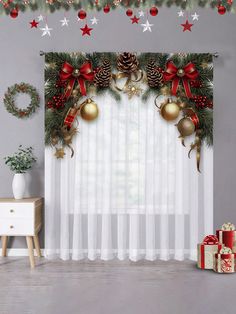 christmas decorations are hanging on the curtain in front of a window with white sheer curtains