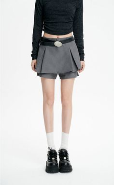 Revamp your wardrobe with the timeless chic of our Pleated Mini Skirt featuring an eye-catching oversized belt detail. This mini skirt channels a blend of sophistication and playful charm with its high-waisted A-line silhouette and crisp pleating. Crafted from a mix of polyester and viscose fibers, it provides both comfort and a flattering drape. The solid color and retro vibe make it a versatile piece for a multitude of settings, from casual outings to more formal affairs. Style this skirt with Trendy Belted Mini Bottoms, Trendy Mini Length Bottoms With Belt, Trendy Mini Skirt With Belt, Trendy Mini Bottoms With Belt, High Waist Belted Skort For Spring, High-waist Skort With Belt For Spring, High Waist Skort With Belt For Spring, Spring High-waist Skort With Belt, Trendy Short Skirt With Belt Loops