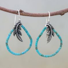 A sterling feather adverts the presence of a majestic bird. Beads of reconstituted turquoise evoke the sky in elegant earrings by Srimuang. .925 Sterling silver Bird Beads, Silver Dangle Earrings, Sterling Silver Dangle Earrings, Artisan Craft, Silver Earrings Dangle, Turquoise Earrings, Elegant Earrings, Hook Earrings, The Sky